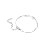 A side perspective view from the reverse side of the Swarovski Swan bracelet, showcasing the smooth, high-shine rhodium-plated backings, bezel settings, and the fluid layout of the link chain.