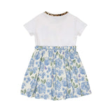 Back view of the Roberto Cavalli white and blue jersey dress, showcasing the clean white upper bodice, leopard-trimmed crewneck, and the continuous hydrangea floral print across the gathered skirt.