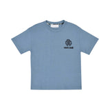 Front view of a Roberto Cavalli Junior blue short-sleeved t-shirt featuring a black embroidered RC monogram and logo on the chest, available at BLUE SALON.