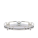Front eye-level view of a Royal Family silver-plated round tray with a mirrored base and decorative geometric open-work railing on a white background.