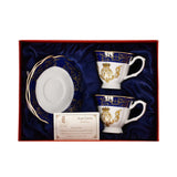 The Royal Family Tea Set displayed inside an open red luxury gift box with blue satin lining, showing two cups and two saucers.