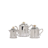 A three-piece Royal Family silver-plated service set including a teapot, creamer, and sugar bowl against a white background.