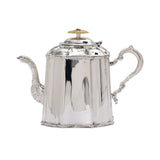 Detailed side view of a tall Royal Family silver-plated teapot featuring a curved spout and ornate handle.