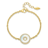 Gold-toned chain bracelet with a circular mother-of-pearl charm featuring clear crystal embellishments and a central cut-out.