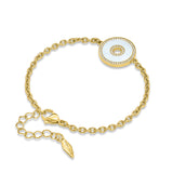 Gold-toned chain bracelet with a circular white inlay pendant, featuring crystals around its perimeter and a central ring. Cl