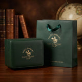 Dark green watch box and matching shopping bag, both with a gold-toned 'Santa Barbara Polo & Racquet Club' logo.