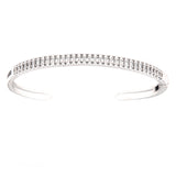 Silver-toned open-cuff bangle adorned with two rows of clear, rectangular-cut simulated stones.