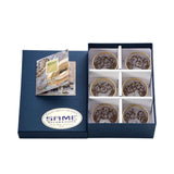 An angled shot of the six-piece Italian crystal set in its protective presentation packaging with the brand's warranty certificate.