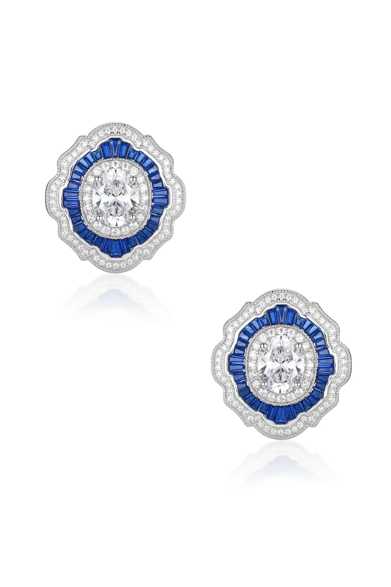 Pair of silver-toned Art Deco earrings with a central clear oval stone, surrounded by blue baguette stones and clear round st