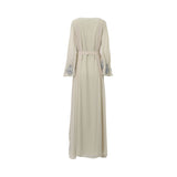 Back view of the SHAIRA embellished maxi dress showing the pleated shoulder details, smooth chiffon fabric, and silver embroidery on the cuffs.