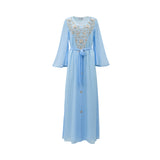 Front view of a SHAIRA sky blue maxi kaftan dress featuring heavy silver floral embroidery on the bodice, V-neckline, and long flared bell sleeves on a white background.