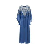 A blue two-piece SHAIRA kaftan set featuring a belted waist and silver floral embroidery on the bodice.
