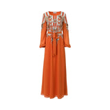 Front view of a SHAIRA burnt orange maxi kaftan gown featuring heavy silver and floral beadwork on the bodice and sleeves with a matching waist tie.