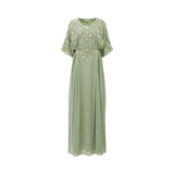 Front view of a SHAIRA sage green maxi kaftan dress featuring gold and silver leaf embroidery on the bodice and a V-neckline.
