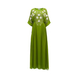 Front view of a floor-length SHAIRA olive green kaftan dress featuring white 3D floral embellishments and silver beadwork on the bodice and sleeves.