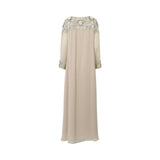 The back of the SHAIRA beige kaftan showing intricate floral embroidery across the shoulders and a flowing chiffon silhouette.