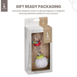 Clear maracas rattle with Sophie La Girafe figure, colorful beads, red ring, clear handle, and a soft white multi-dot fabric