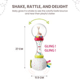 Sophie La Girafe rattle: clear top with giraffe and beads, clear hourglass middle with beads, and a soft white polka-dot fabr