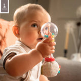Multi-colored maracas rattle. Clear globe with Sophie La Girafe and beads, yellow handle, soft polka-dotted fabric base with