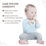 Cream ring teether with a cream and brown spotted giraffe head.