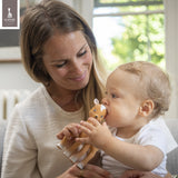 Brown fawn-shaped baby teether toy with white muzzle, forehead patch, and hooves.