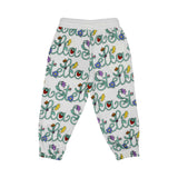 White sweatpants with colorful 'Stella' pattern on a white background
