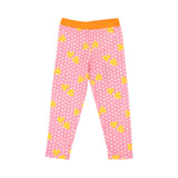 Pink leggings with yellow heart patterns on a white background