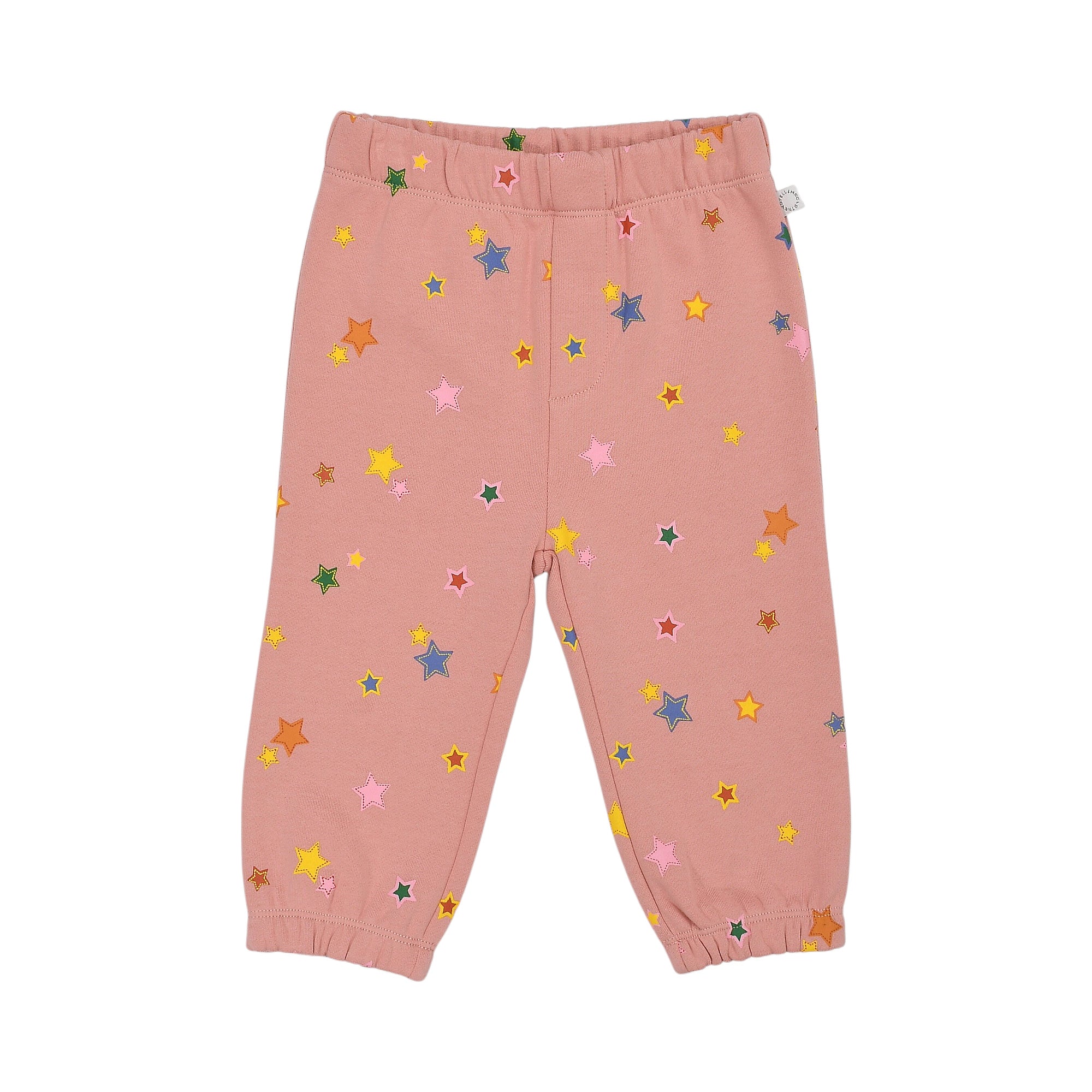 Pink jogging pants with an elastic waist and cuffs, covered in scattered multi-colored star patterns.