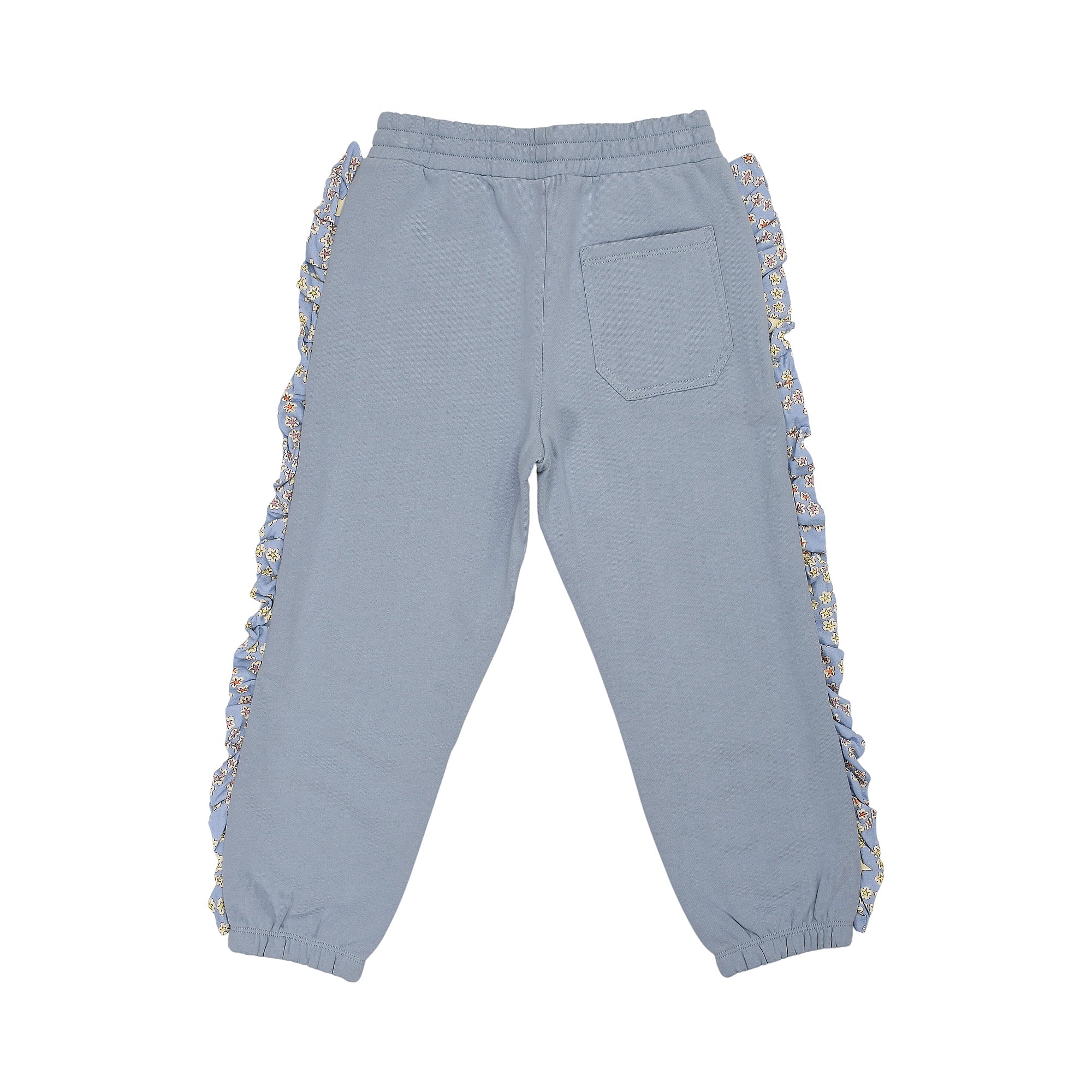 Blue jogging pants with elastic waist and cuffs. Features a back patch pocket and ruffled floral trim on both outer leg seams
