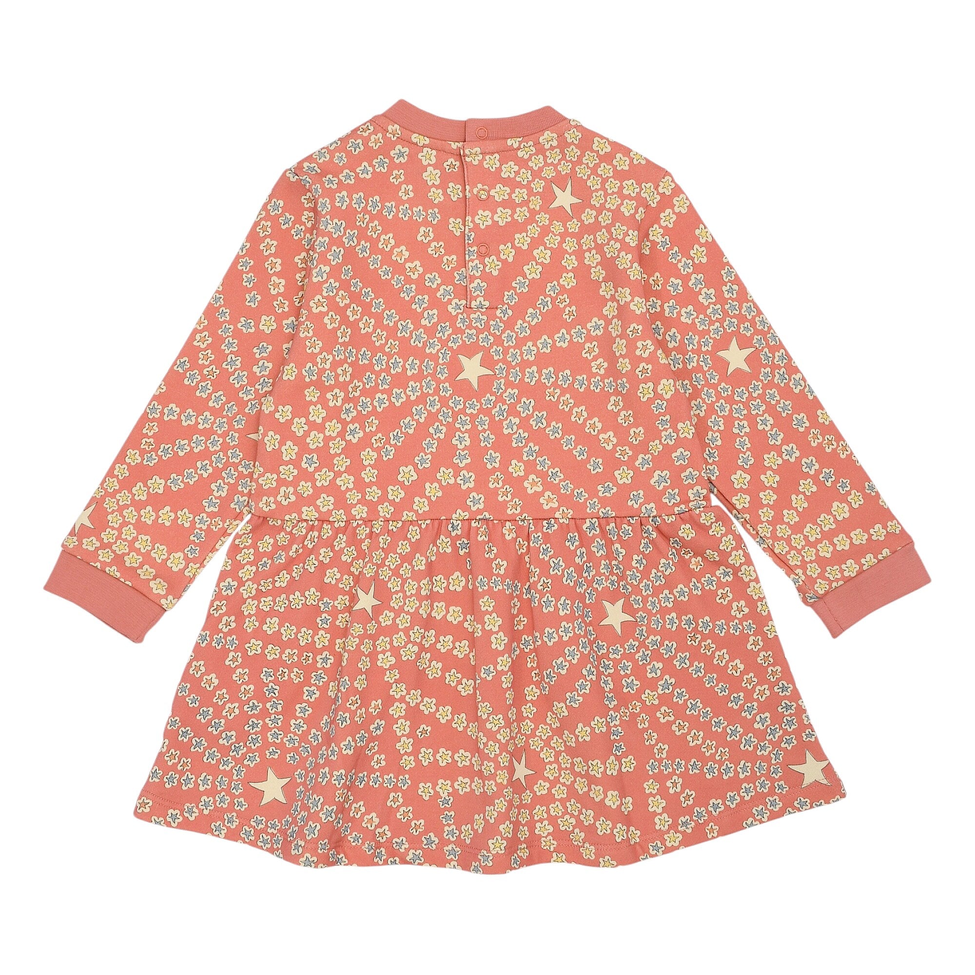 Peach long-sleeved dress with small yellow and blue floral diagonal stripes, scattered cream stars, ribbed cuffs, and back bu