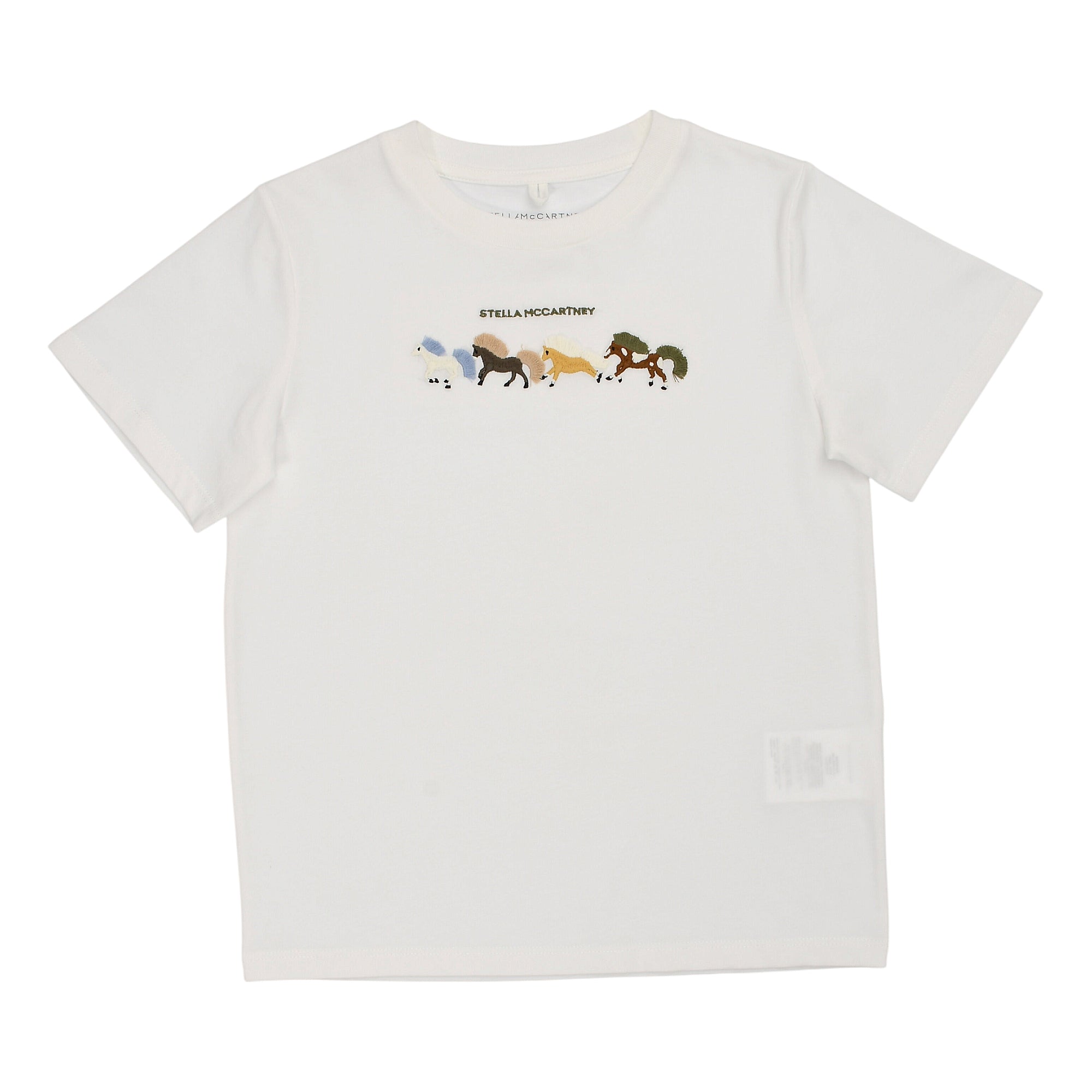 White short-sleeved crew neck T-shirt with a graphic print of several colourful horses and "STELLA MCCARTNEY" text.
