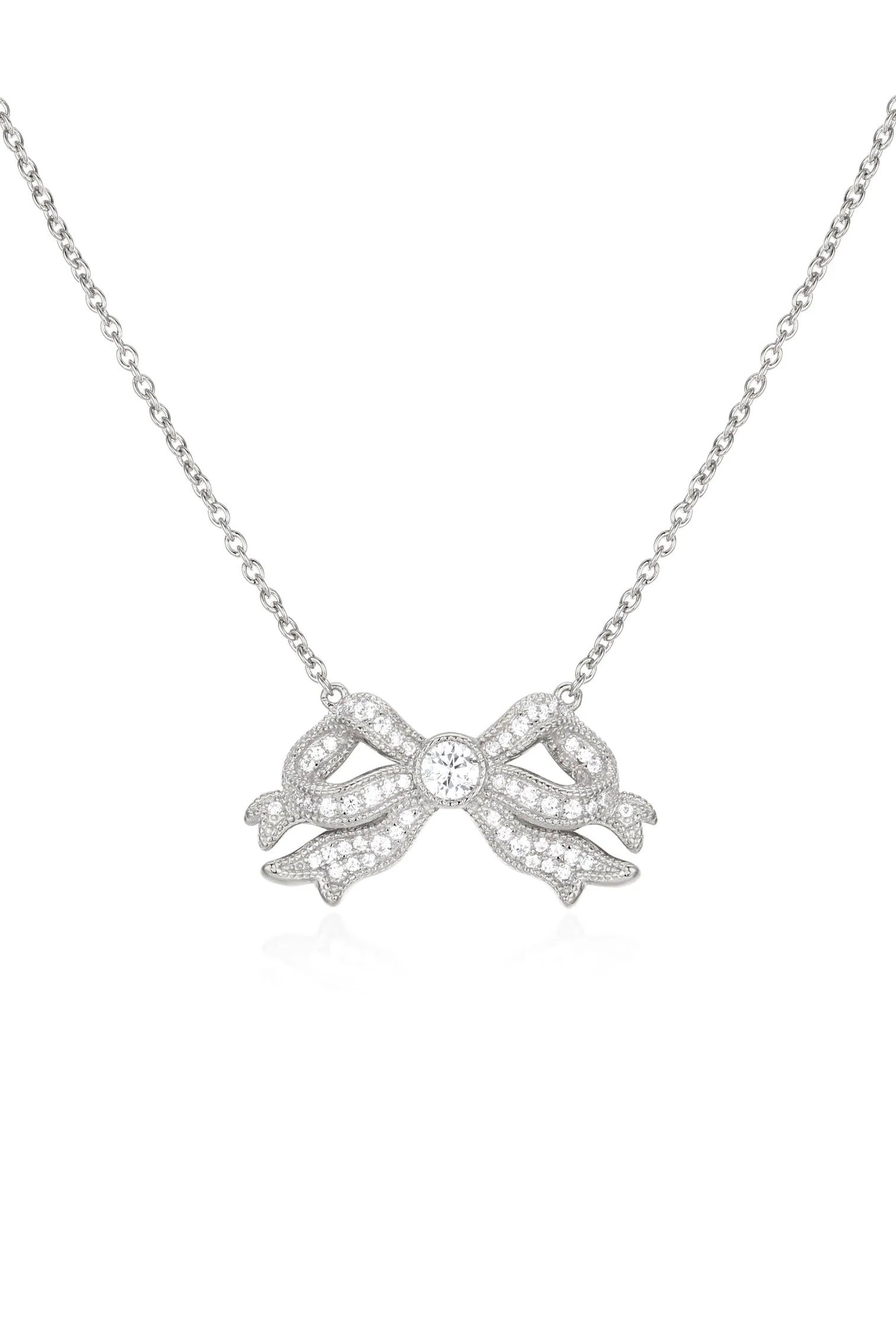 Silver-toned bow necklace with a central clear round stone and pavé-set clear stones on a delicate chain.