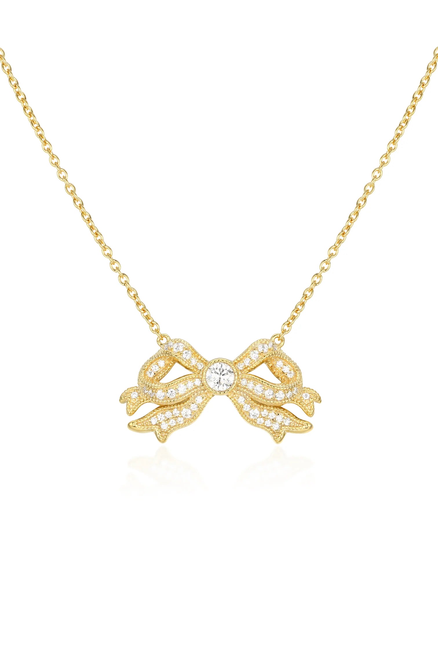 Gold-plated bow necklace with pavé-set clear stones and a larger central clear stone, on a delicate gold-toned chain.
