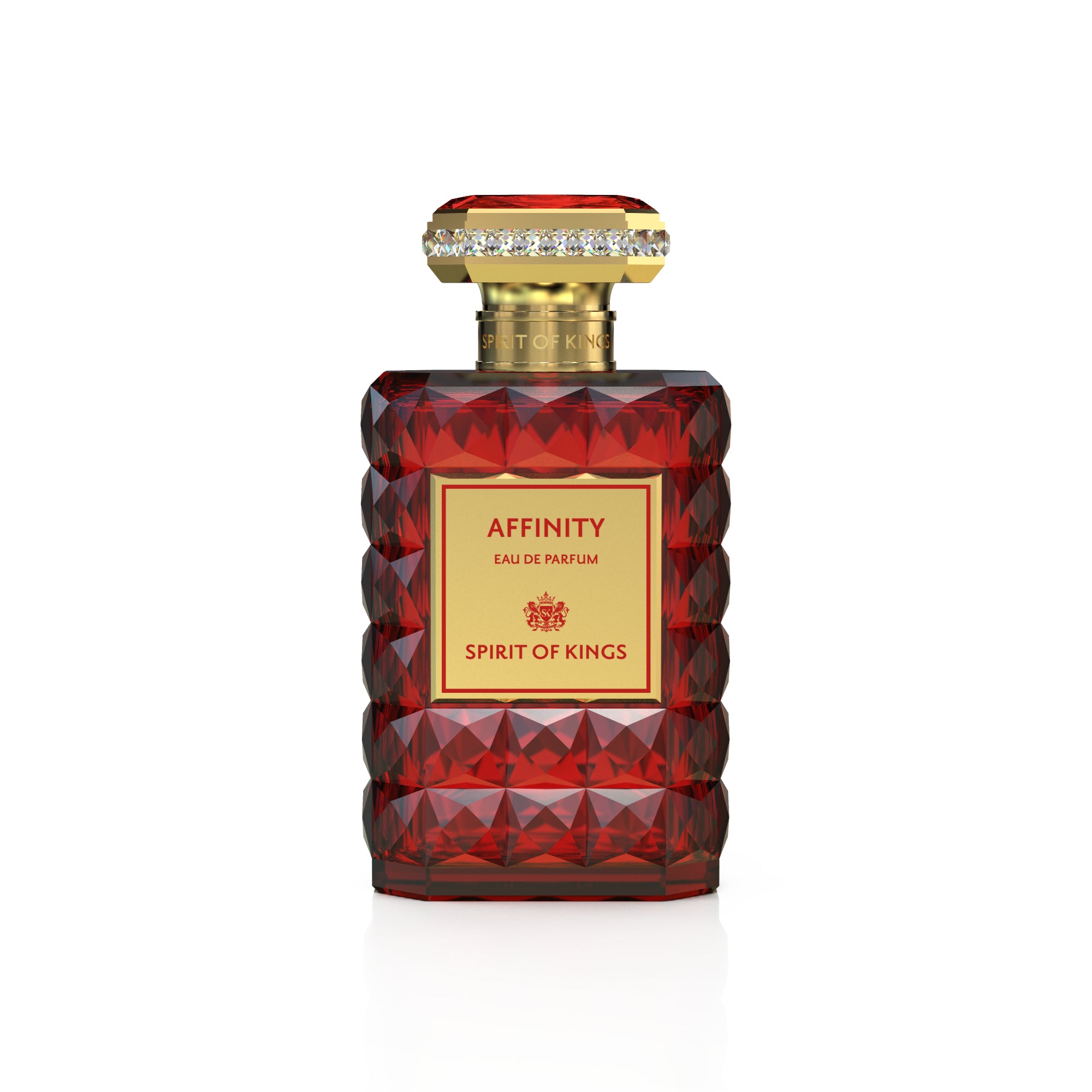 Red faceted glass perfume bottle with a gold-toned cap featuring a band of clear crystals and a gold label.
