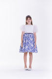 Off-white bodice dress with sheer ruffled sleeves and a blue and white striped, floral-patterned pleated skirt.