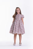 Purple kids' dress with white and yellow striped pattern, white floral overlay, ruffled bodice, and puffed short sleeves.