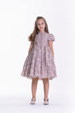 Purple A-line dress with yellow-toned and white striped pattern, white floral overlay, ruffled bodice, puffed sleeves, and la