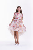 Beige floral print dress with short sleeves, round neckline, and a voluminous high-low ruffled skirt with a red belt.