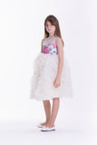 Off-white sleeveless kids' dress with a sequined floral bodice and a full, tiered ruffled skirt.