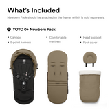 Toffee newborn pack: canopy with black 5-point harness, padded mattress, rounded head support, and foot cover with white fluf