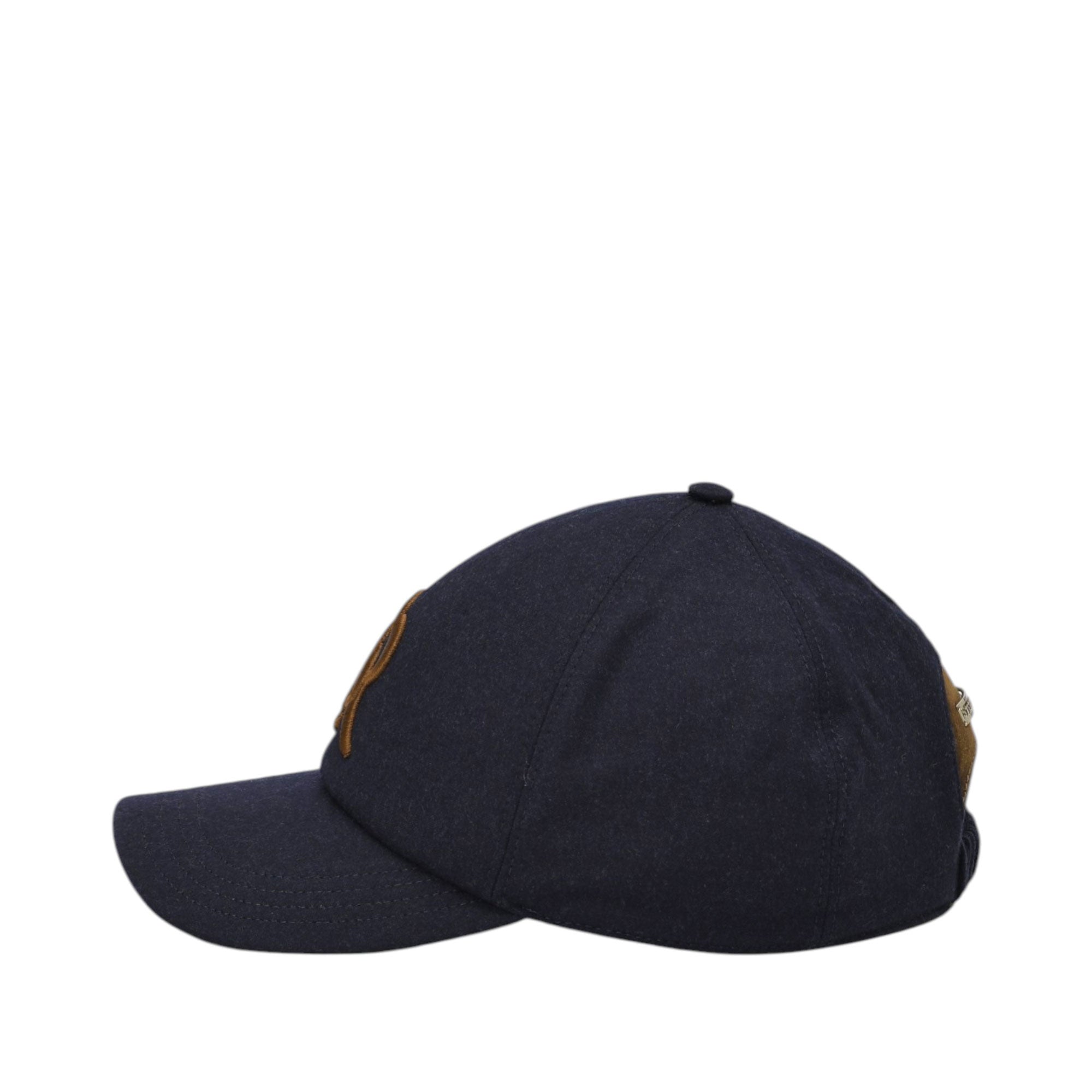 Navy blue baseball cap with a curved brim, a brown patch on the front, and a brown strap with a gold-toned buckle at the back