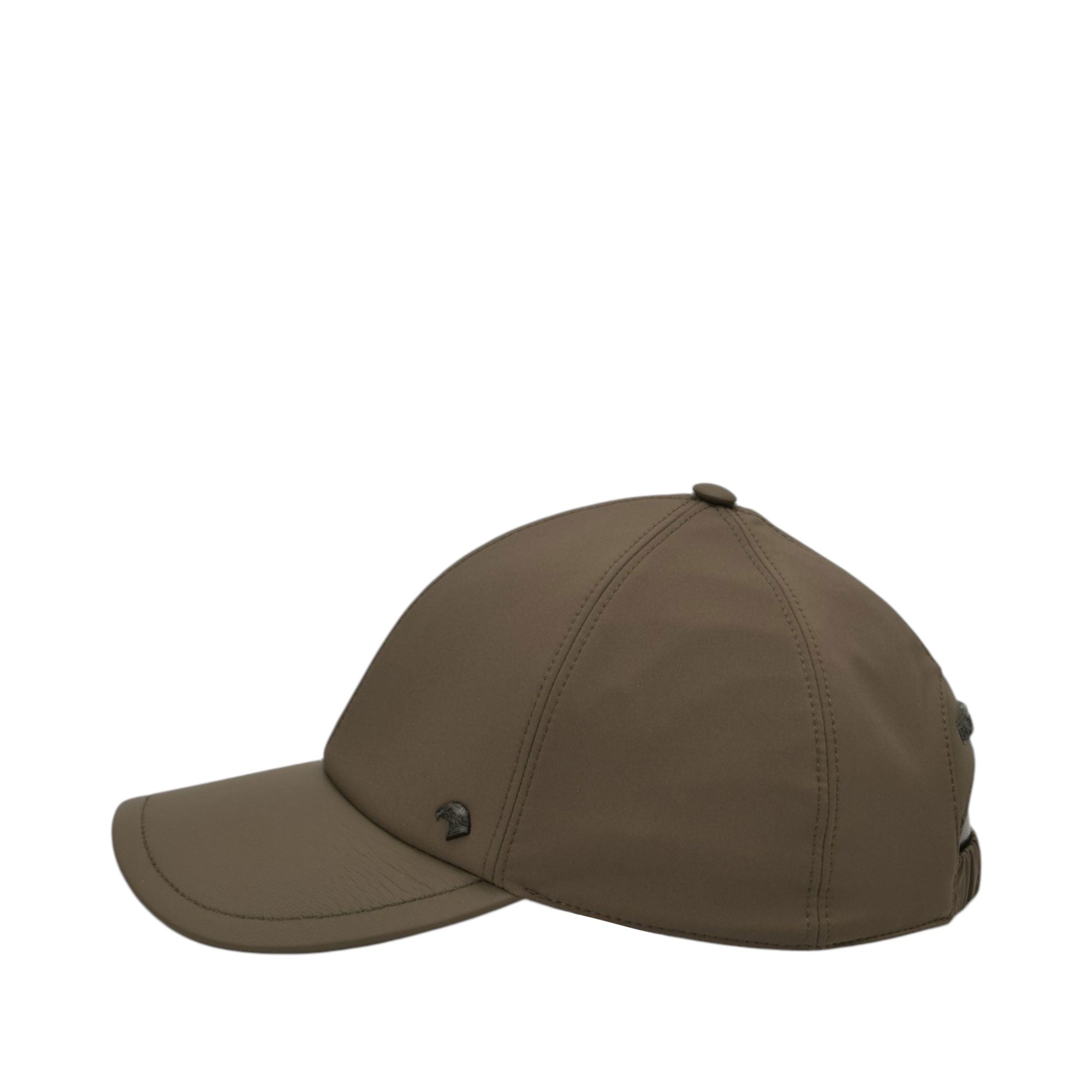 Khaki grey baseball cap with a curved brim, six-panel crown, top button, and a dark-toned metal emblem on the front left. Adj