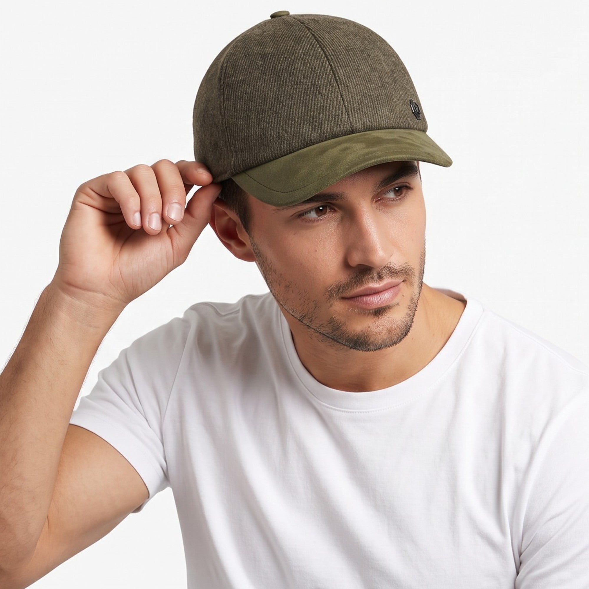Dark olive green baseball cap with a textured crown and smooth olive green brim. Small dark emblem on front.