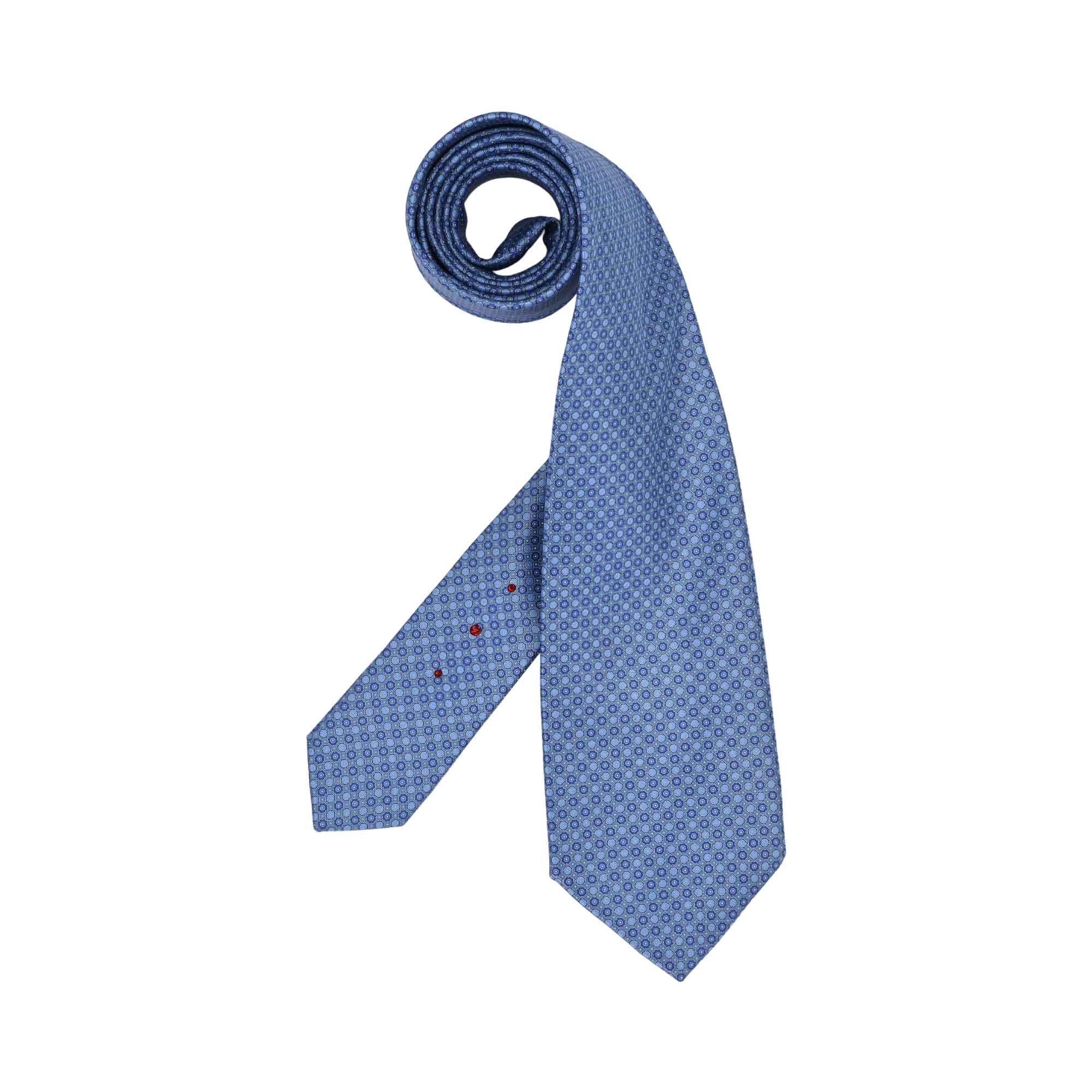 Light blue tie with repeating concentric circle pattern. Narrow end has three small red dots. One end is coiled.