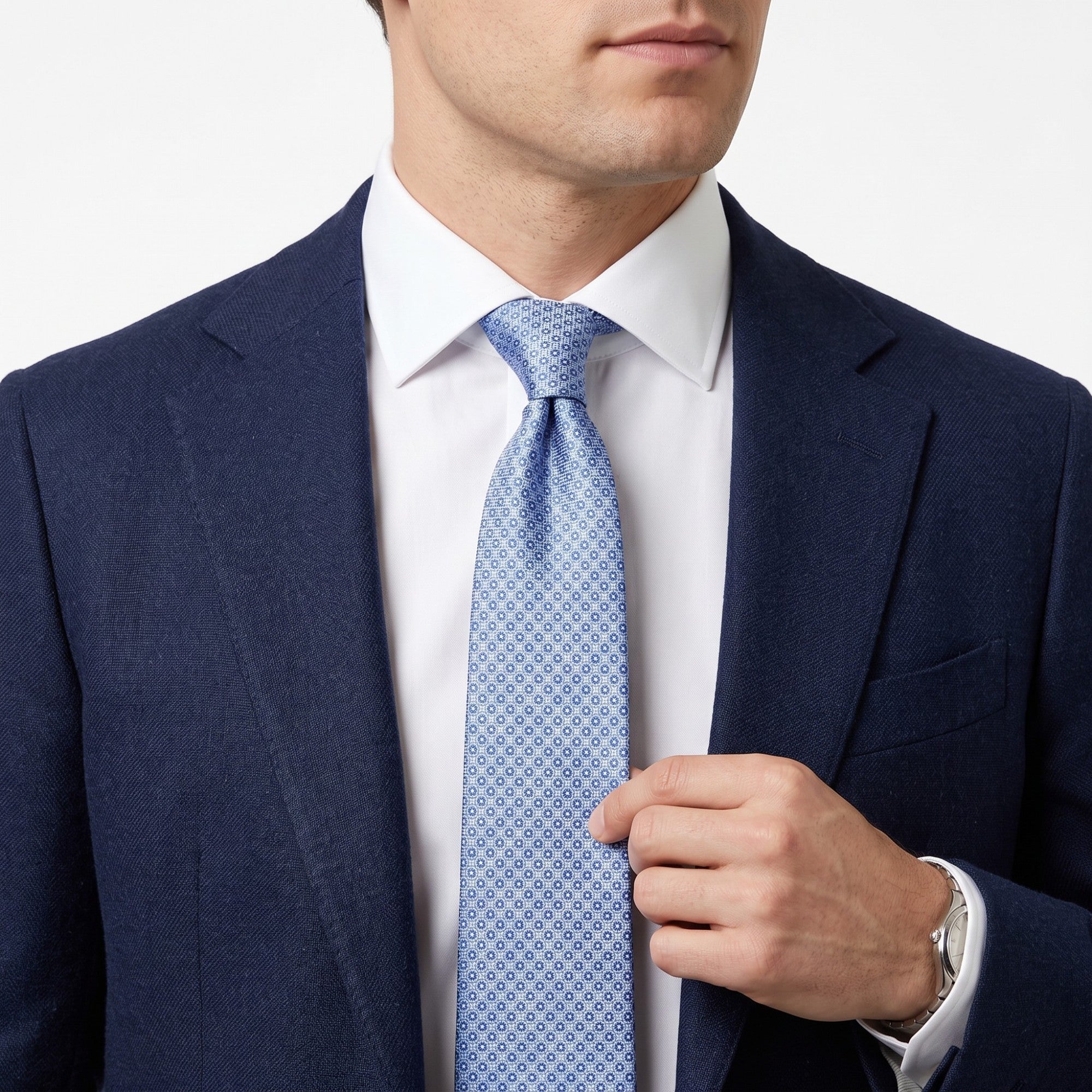 Light blue woven tie with a repeating pattern of small blue circles with darker centers.