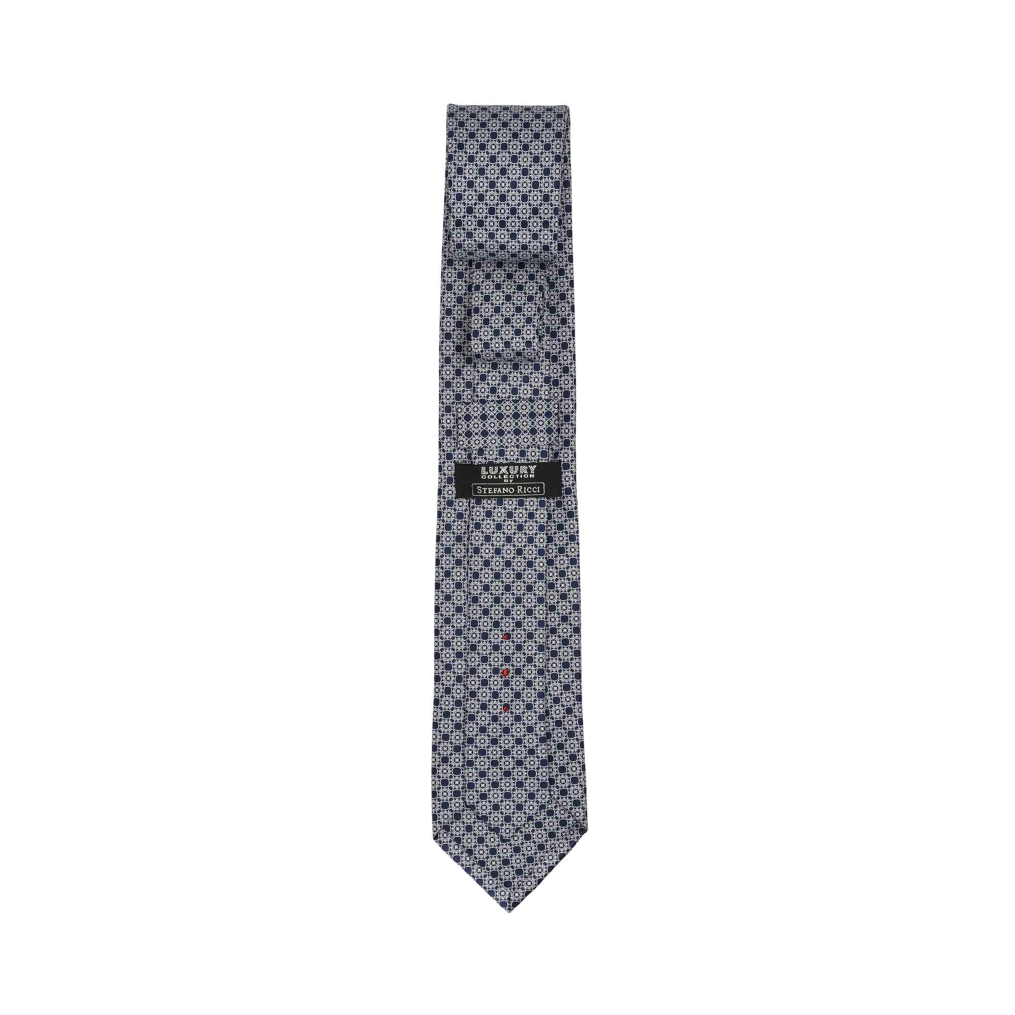 Navy blue tie with a repeating light grey geometric square pattern. Features a black 'LUXURY COLLECTION STEFANO RICCI' label