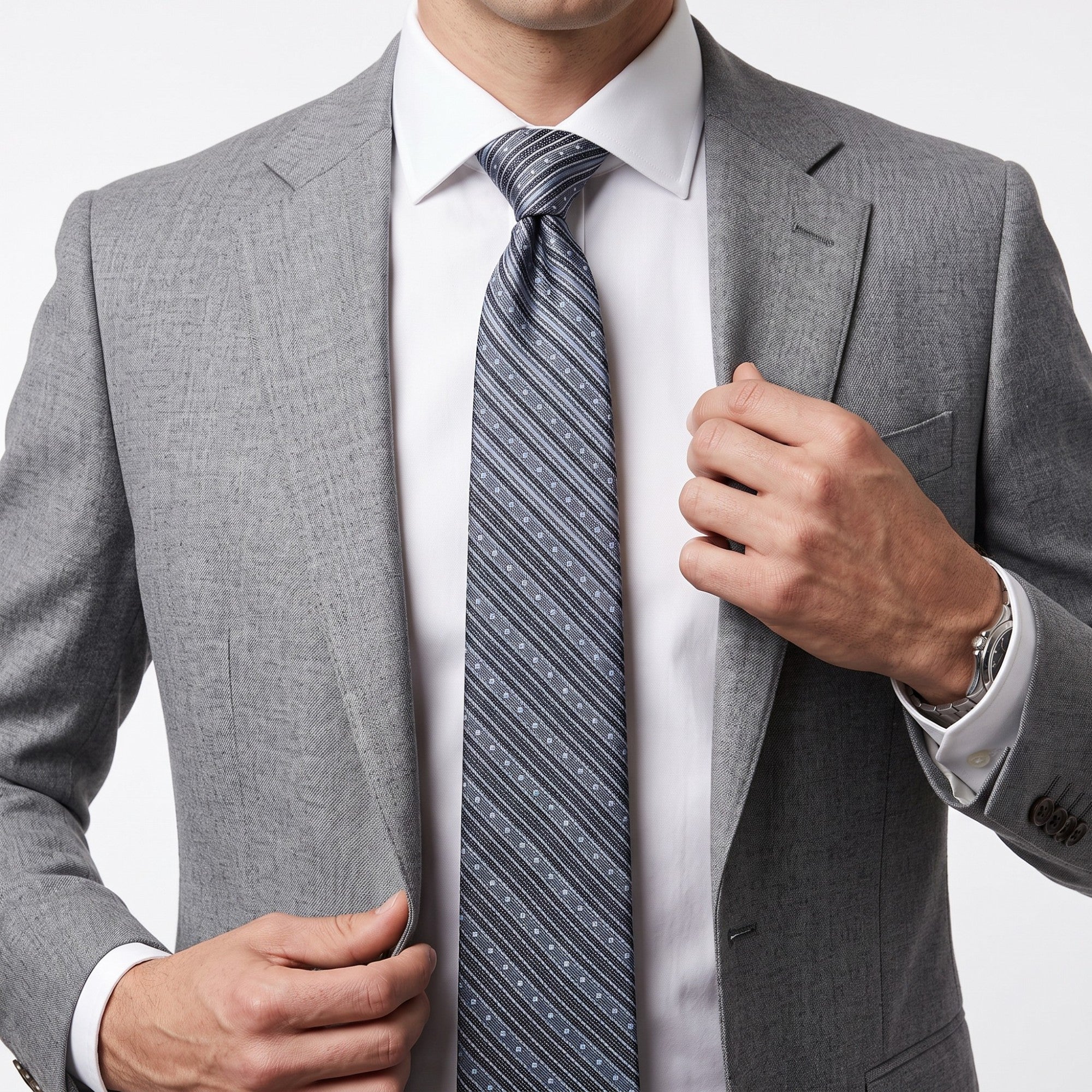 Navy blue tie with diagonal stripes: solid light blue stripes and navy stripes with white dots.