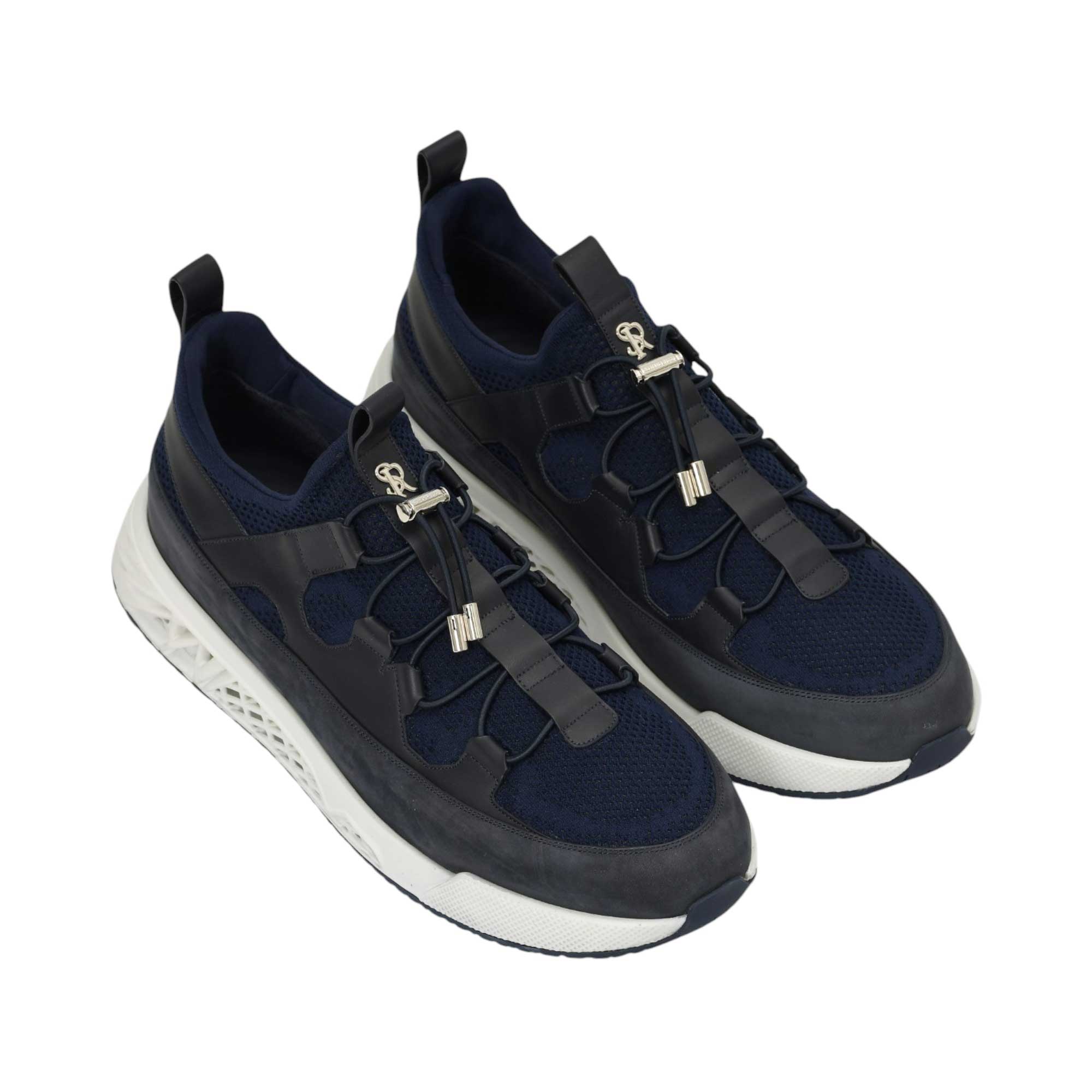 Pair of navy blue mesh sneakers with dark blue overlays, elastic bungee laces, silver-toned toggles, 'S' emblem, and white ch