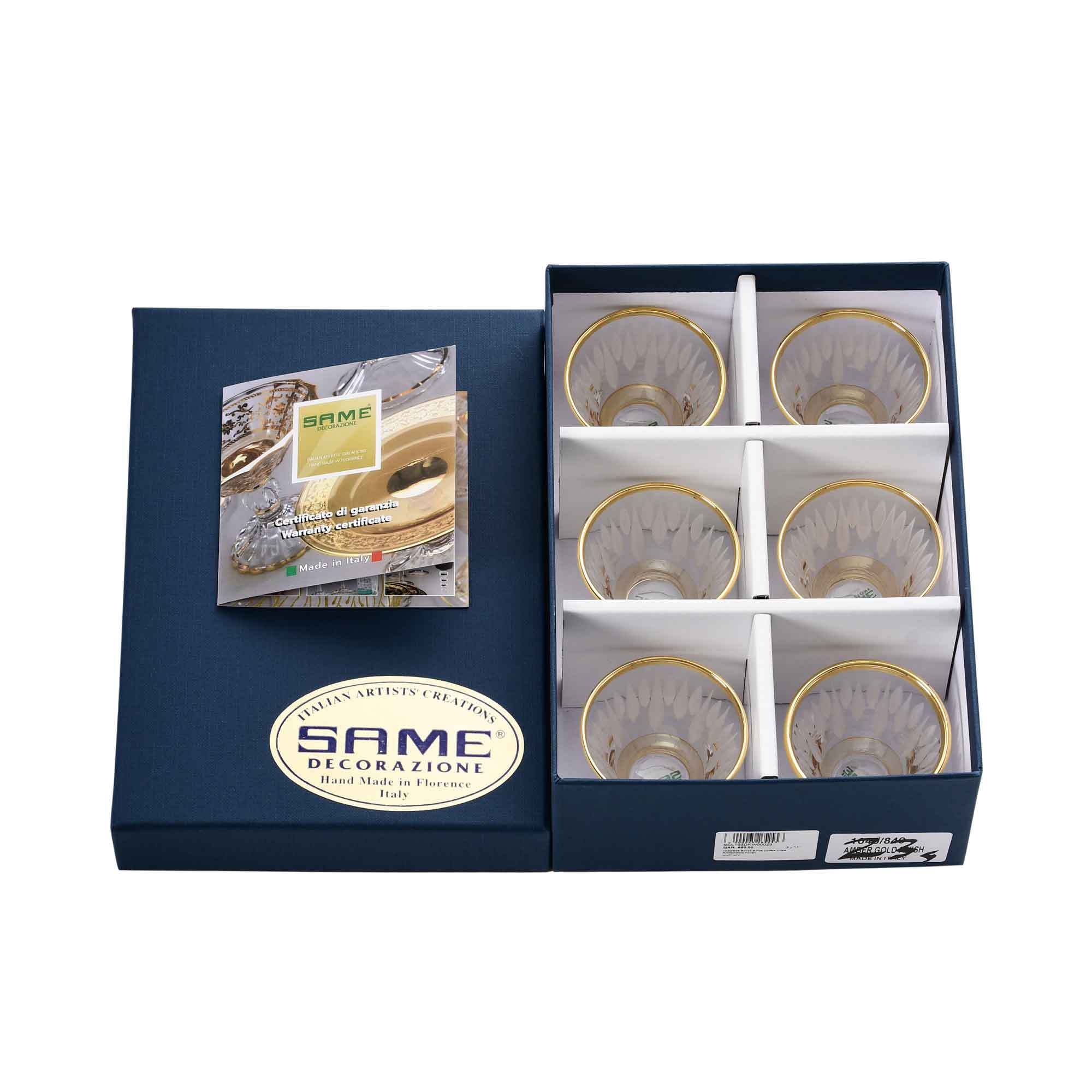 A set of six tall crystal goblets with ornate gold patterns displayed in a luxury navy blue presentation box.