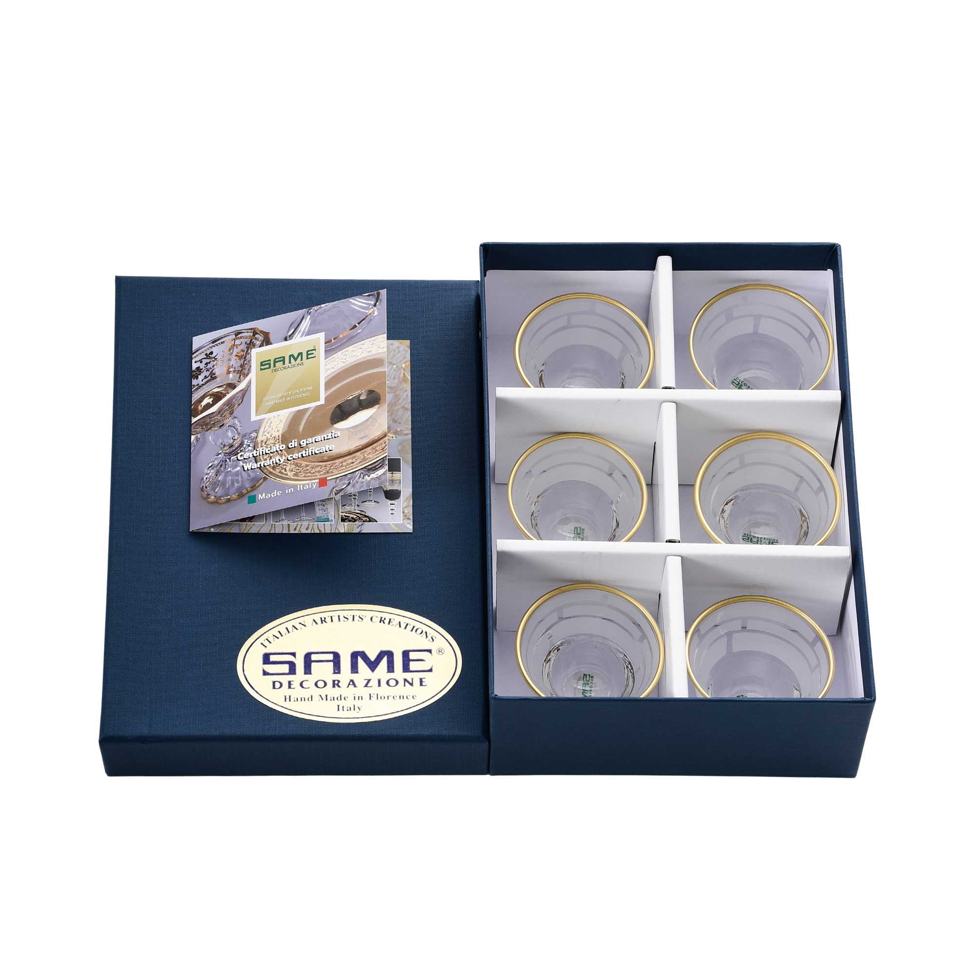 An angled shot showing the six-piece Italian crystal set nestled in protective white packaging with an authenticity card.